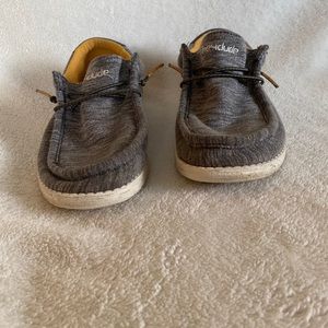 Hey dude loafer shoes, grey and white on the outside, and camel color inside.